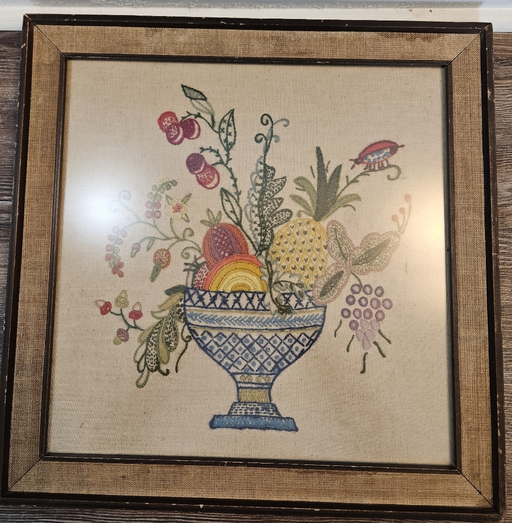 vintage framed Jacobean crewel embroidery piece featuring a fruit bowl design